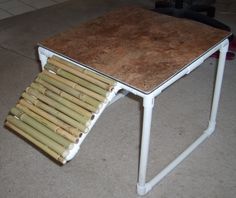 a small table made out of bamboo sticks and plywood board on the bottom half