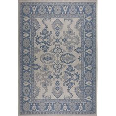 a blue and white rug with an ornate design on the bottom, in front of a white background