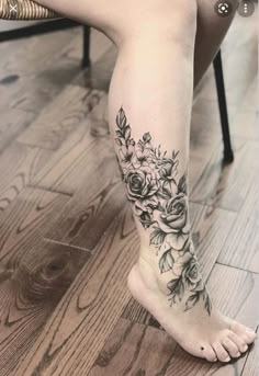 a woman's foot with flowers on it