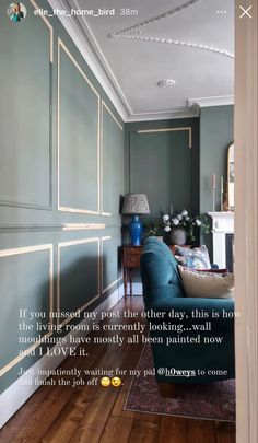 a living room with green walls and wood flooring is shown in an instagram