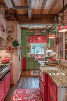 this kitchen has pink and green cabinets, wood floors, and an area rug that matches the wooden ceiling