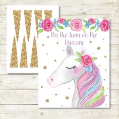 a card with a unicorn's face and flowers on it