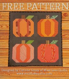 an orange quilted pumpkin pattern on a brown background, with three smaller ones in the center