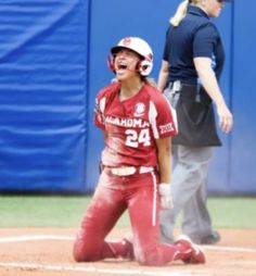 a baseball player is laughing on the field