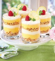 three desserts with lemon slices and strawberries on top