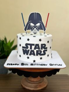 a star wars themed birthday cake with darth vader and stars on the top