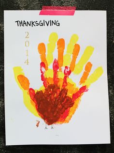 a child's handprinted thanksgiving card with the number four on it and an orange turkey