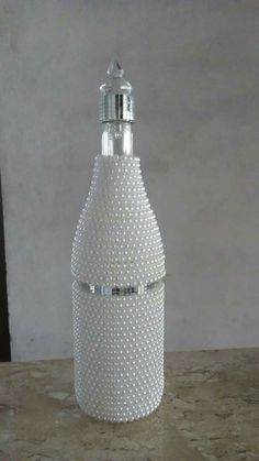 a white bottle sitting on top of a table