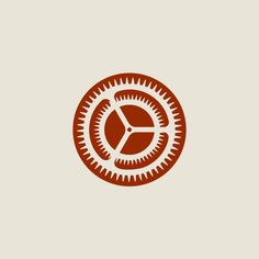 an orange and white logo with gears in the center on a light brown background that says,