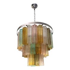 a multi colored chandelier hanging from a ceiling