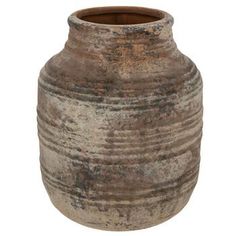 an old, dirty vase is shown on a white background