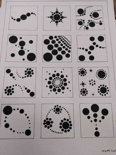 a sheet of paper that has some black dots on it and white squares in the middle