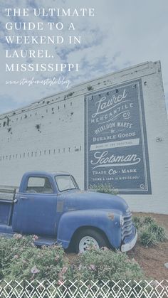 an old blue truck parked in front of a building with a sign that says the ultimate guide to a weekend in laurel, mississippi