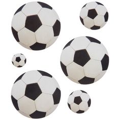 four black and white soccer balls on a white background