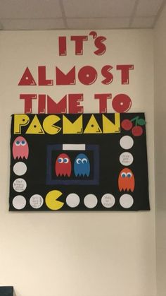 there is a sign on the wall that says it's almost time to pacman