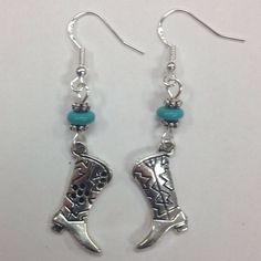 Cowboy Boot Western Earrings with genuine turquoise accent beads dangle delicately on sterling earwires.  Perfect for the horse lover, Western theme or horse lover.  The charm is pewter and the earwires are sterling (for happy ears).  All earrings come with rubber stoppers. Cowboy Earrings, Cowboy Jewelry, Boot Earrings, Cowgirl Accessories, Horse Earrings, Cowgirl Boot, Western Earrings, Turquoise Accents, Boot Jewelry