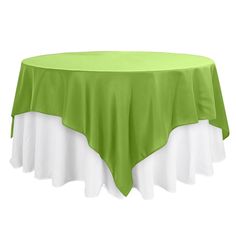 a green and white table cloth on top of a round table with two white ruffles