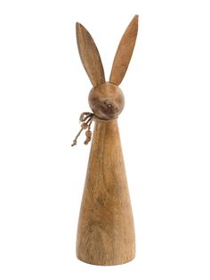 a wooden bunny figurine on a white background