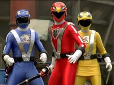 three power rangers standing next to each other