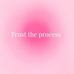 the words trust the process against a pink background