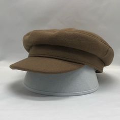 a hat is sitting on top of a white base