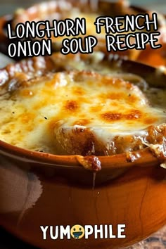 a close up of a casserole dish with cheese on top and the words longhorn french onion soup recipe