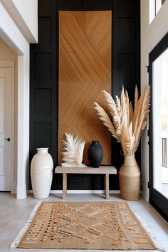 Stylish foyer with natural decor, board and batten accent wall, and decorative vases. Textured Black Wall, Albany Aesthetic, Entry Accent Wall, Industrial Foyer, Accent Ceiling Ideas, Small Accent Wall, Board And Batten Accent Wall, Batten Accent Wall, Accent Wall Entryway