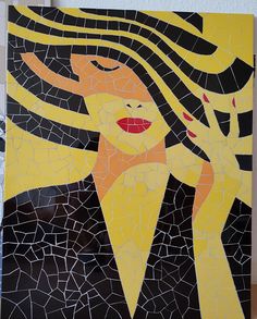 a woman with her hair blowing in the wind is depicted on a mosaic tile wall