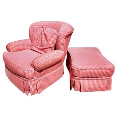 a pink chair and footstool sitting next to each other on a white background