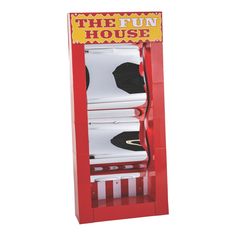 the fun house is red and white with black hats on it's display stand