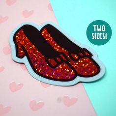 ❤ WHAT YOU GET ❤ A sparkly ruby slipper sticker that glitters with each turn in the light--glossy die cut waterproof vinyl sticker, protected with UV coating. The perfect addition to any laptop, water bottle, bike helmet--wherever your heart desires! This sticker is meant to last. I was always mesmerized by Dorothy's magic slippers in the Wizard of Oz and wanted to create a sticker to bring that magic to your everyday. The red ink lets the big dust sparkle vinyl shine--it looks a little different every time you see it!  SHIPPING: Please note that USPS First Class mail has been *especially* slow lately. Please upgrade to Priority if you need a more reliable delivery date and tracking. SIZE OPTIONS: 3 inches wide (Small), 4.75 inches wide (Large) MATERIAL: Durable shiny vinyl, waterproof, wi Wizard Of Oz Dorothy, Create A Sticker, Magic Shoes, Sparkle Shoes, Ruby Slippers, Glitter Dust, Slippers Shoes, Sticker Laptop, Red Ink