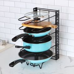 a stack of pots and pans sitting on top of a counter