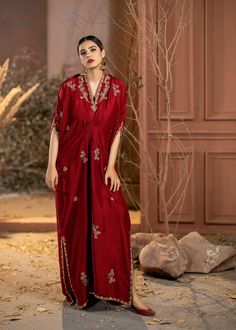 Wrap yourself in style with our Red Rawsilk Kaftan. It's a perfect blend of classic and modern, making you look effortlessly elegant. Elevate your fashion game with ease. Bollywood Style Silk Evening Sets, Traditional Silk Sets For Evening, Traditional Silk Evening Sets, Formal Floor-length Festive Abaya, Formal Festive Floor-length Abaya, Elegant Formal Gown For Eid, Elegant V-neck Sets For Festive Occasion, Traditional Satin Sets For Evening, Elegant Gown With Dabka For Designer Wear