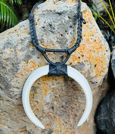 PLEASE NOTE...we currently only have one of these in stock and the one shown with the red background is the exact on you will receive..because the tusks are smaller, we've reduced the price. Add a touch of primal, masculine style to your wardrobe with our authentic Boar's Tusk Necklace. Handcrafted in the traditional Polynesian and Micronesian style, this rugged necklace is perfect for any island warrior. The necklace portion is about 22” in around. Please note every piece is unique as these are Tusk Pendant, Tusk Necklace, Masculine Style, Body Pose Drawing, Island Girl, Body Poses, Red Background, Luggage Tags, The Necklace