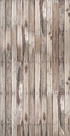 an old wooden fence is painted white and has brown wood grains on the boards