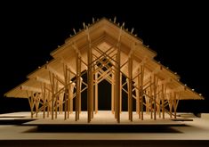 an architectural model of a building made out of wood sticks and plywood beams with lights on the roof