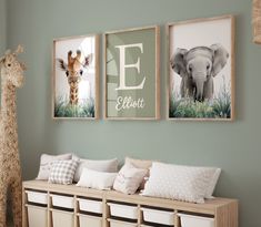 three framed pictures hang on the wall above a wooden bench with storage bins underneath