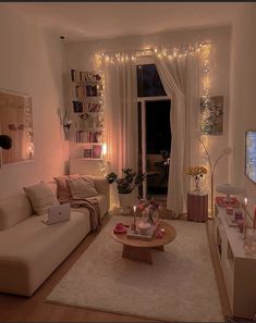 a living room filled with furniture and a flat screen tv