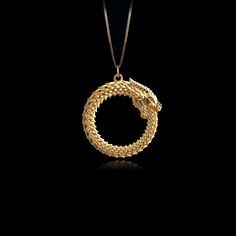 PENDANT INFORMATIONThis pendant is made of real, solid gold.• Made in USA• Material: 14k or 18k solid gold• Finish: polished• Height: 1.19" (30 mm) x Width: 1.11" (28 mm)• Pendant weight: approx. 6 grams (14k)• Bail: fits up to 4 mm chains• Solid back, not hollow• A certificate of authenticity is included• Delivered in our elegant jewelry box, making it the perfect gift Shipping: All of our orders are custom-made. Please allow approximately 3 weeks for production and shipping. Shipping includes Ouroboros Jewelry, Gold Dragon, Solid Gold Necklace, Solid Gold Chains, Box Making, Mini Pendants, Dragon Pendant, Yellow Gold Chain, Yellow Gold Pendants