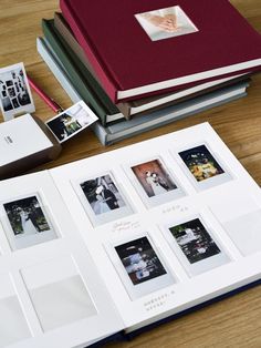 an open book on a table with pictures and photos