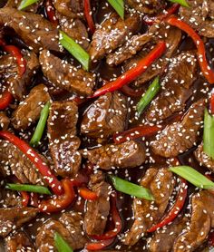 beef and peppers with sesame seeds in a brown sauce