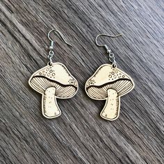 the earrings are made out of wood and have two different designs on each earring