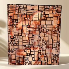 an abstract painting with squares and rectangles in orange, brown and black colors