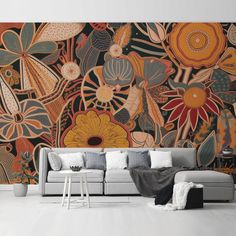 a living room with a large mural on the wall and a couch in front of it