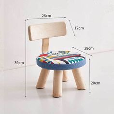 a wooden chair with a colorful seat cushion on it and measurements for the back side