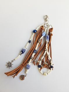 the necklace is decorated with beads and charms