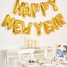 the balloons are all over the table for this new year's eve dinner party