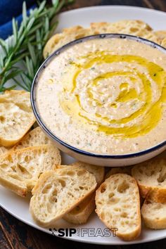 a white plate topped with bread and dip