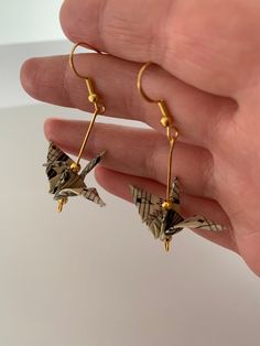 Here is your next favorite pair of artsy earrings. Handmade and carefully crafted  crane earrings, each piece is unique. Made from vintage musical note paper and gold plated brass findings, refined and (painted) by hand by an artistic jeweller in the UK. Artsy Earrings For Gift, Handmade Earrings Ideas, Paper Crane Earrings, Paper Crane Jewelry, Paper Crane Necklace, Music Earrings, Earring Unique, Origami Crane Earrings, Crane Earrings