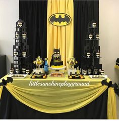 a batman themed birthday party with black and yellow decorations